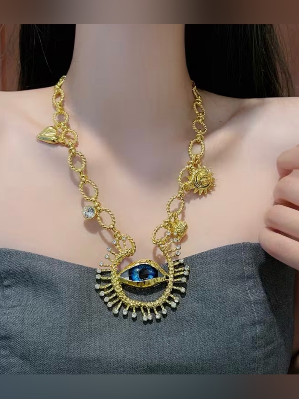 Schiaparelli Inspired Gold Eye Pendant Necklace with Blue Accent